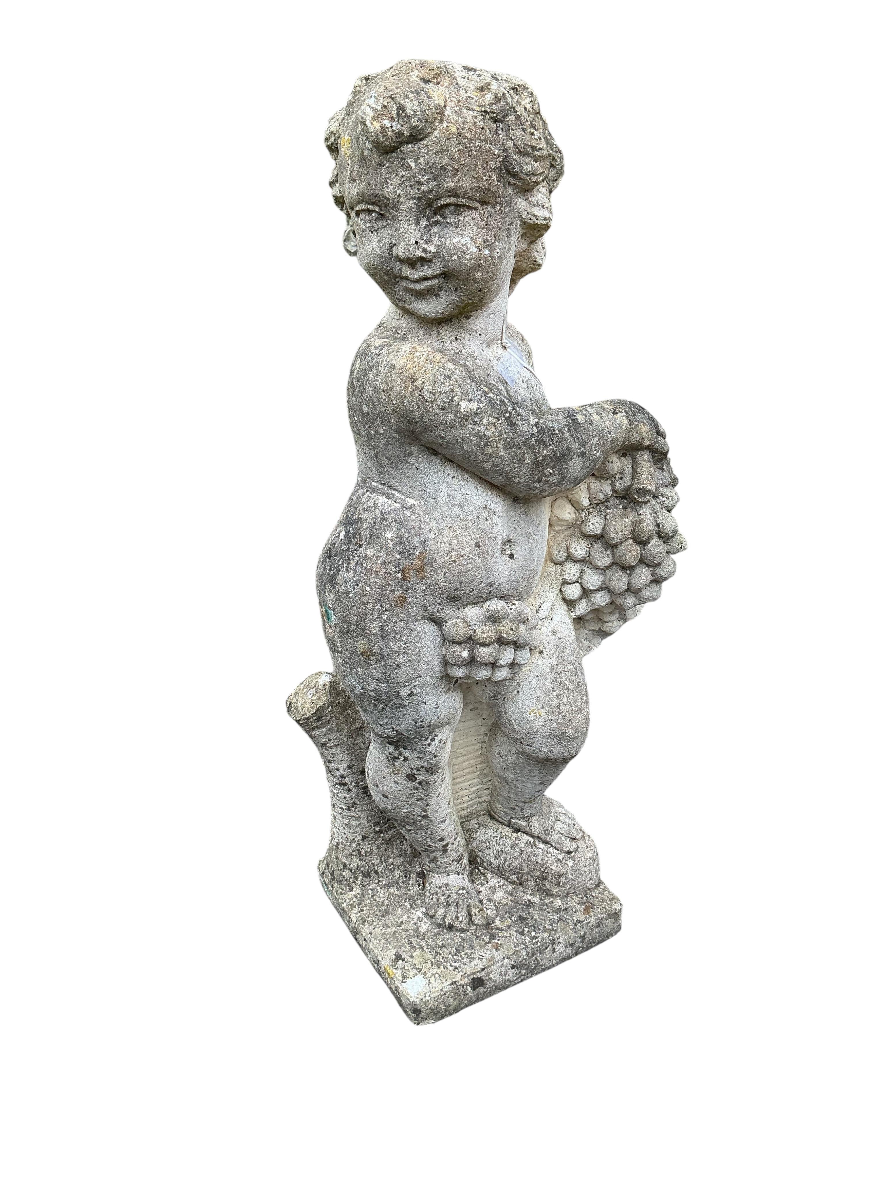 A pair of reconstituted stone cherub garden ornaments, height 80cm
